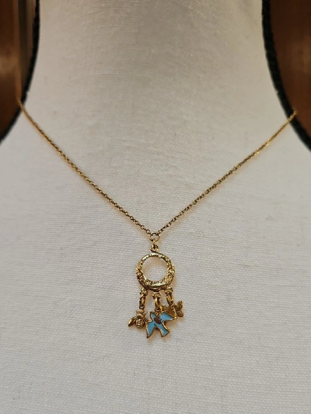 1928 Gold-Tone Circle Necklace with Blue Enamel Bird Bee Butterfly Charms